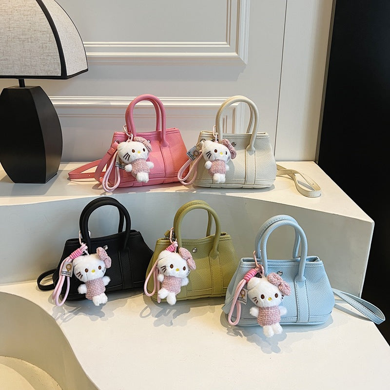 Damen Mini-Handtasche mit verspieltem Plüschanhänger