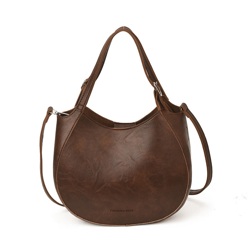 Damen Schultertasche aus hochwertigem Kunstleder mit modischem Besatz
