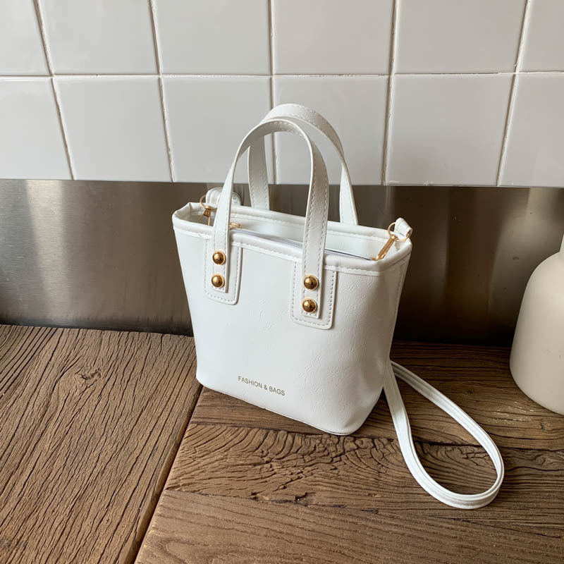 Damen Mini-Handtasche mit elegantem Tragegriff und praktischem Innenfach