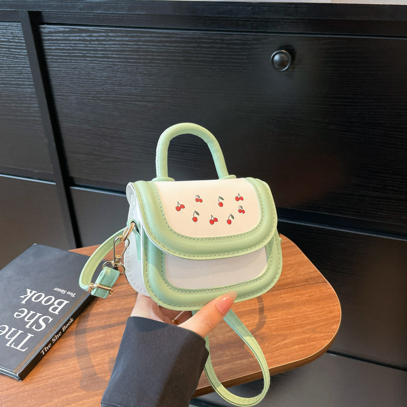 Damen Mini-Handtasche mit fröhlichem Kirschdesign und charmanten Anhängern