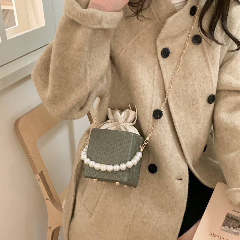 Damen stilvolle Mini-Handtasche mit Kordelzug und Perlenakzent
