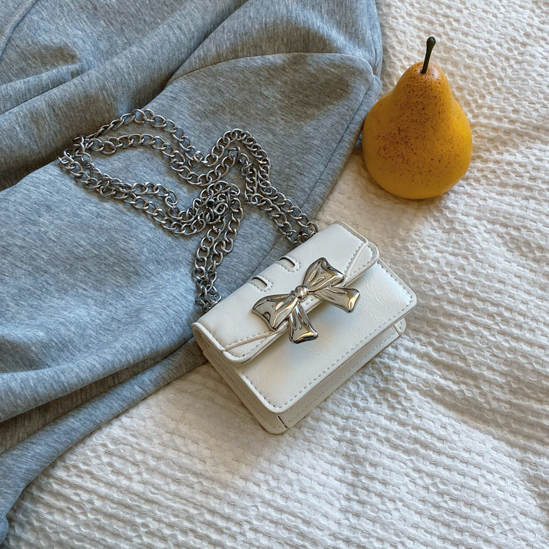Damen Mini-Handtasche mit schimmerndem Schleifenverschluss