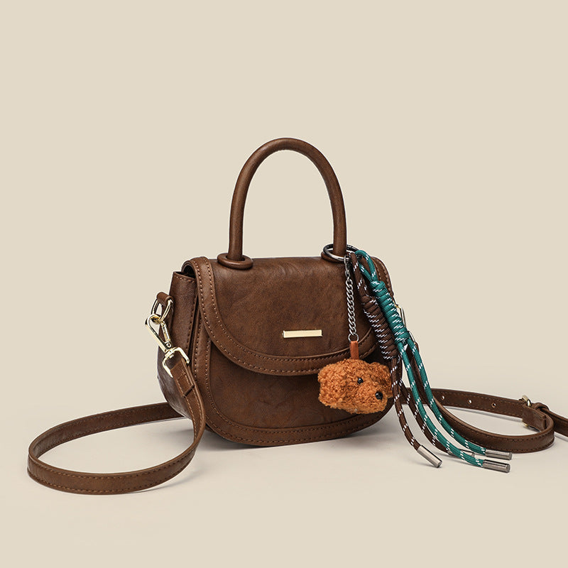 Damen Mini-Handtasche mit verspieltem Detail und hochwertigem Kunstleder
