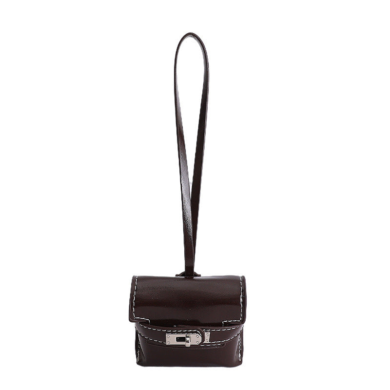 Damen Mini-Handtasche aus hochwertigem Kunstleder mit verspieltem Verschluss