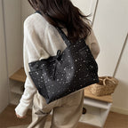 Damentasche mit glitzerndem Sternmuster