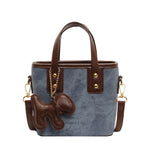 Damen-Mini-Tasche aus hochwertigem Material mit abnehmbarem witzigen Anhänger