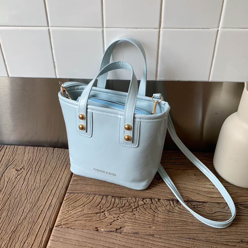 Damen Mini Tasche mit eleganter Struktur und praktischem Tragegriff