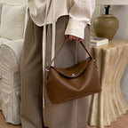 Damenhandtasche mit flexiblem Riemen und elegantem Design