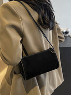 Elegante Schultertasche aus Wildleder